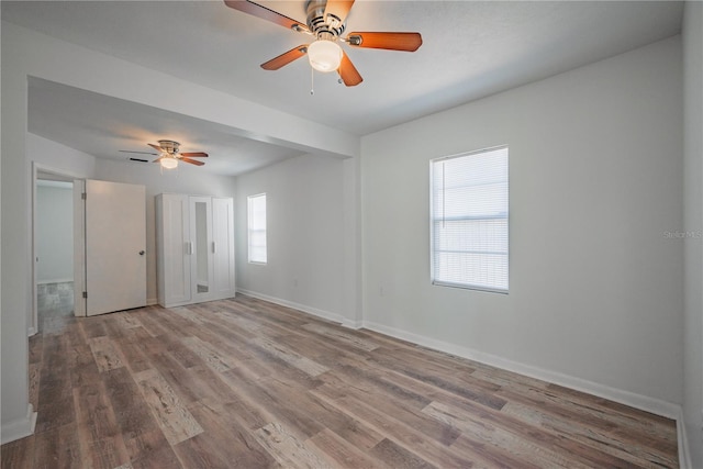 701 W Idlewild Ave, Tampa, FL 33604 - unfurnished room featuring ceiling fan, baseboards, and wood finished floors