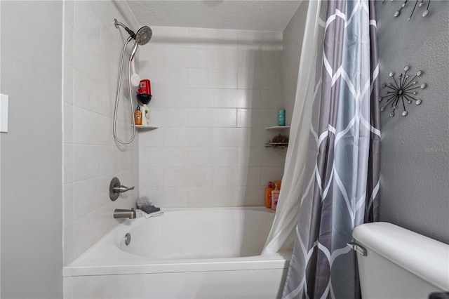 full bathroom featuring a textured ceiling, shower / tub combo, and toilet