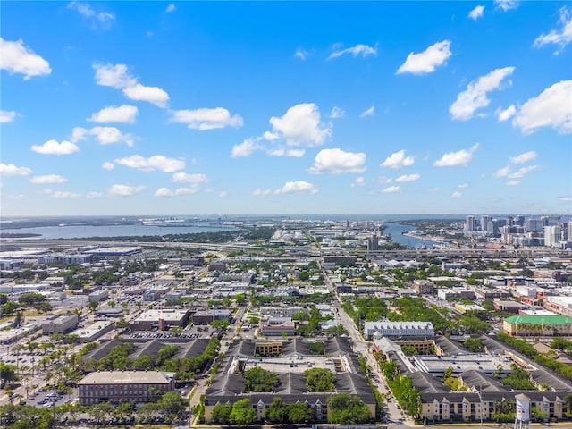 drone / aerial view featuring a city view and a water view