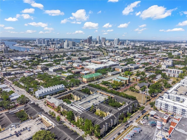 birds eye view of property featuring a city view and a water view