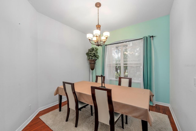 2539 Centennial Falcon Dr, Valrico, FL 33596 - dining room with a chandelier and wood finished floors