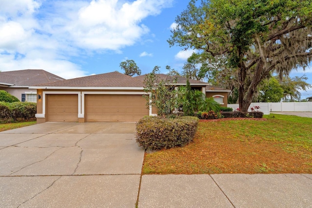 2539 Centennial Falcon Dr, Valrico, FL 33596 - ranch-style home featuring a garage, concrete driveway, and stucco siding