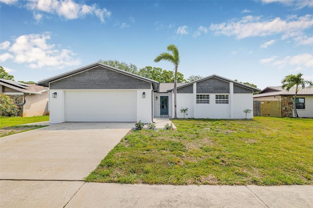 12641 98th St, Largo, FL 33773 - mid-century inspired home featuring a garage, stucco siding, driveway, and a front lawn