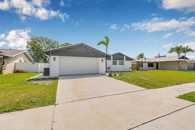 12641 98th St, Largo, FL 33773 - ranch-style home featuring a garage, fence, a front lawn, a gate, and driveway