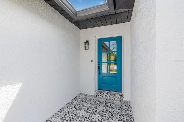 12641 98th St, Largo, FL 33773 - property entrance featuring stucco siding