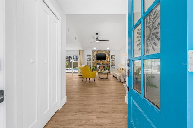 12641 98th St, Largo, FL 33773 - corridor with light wood-style flooring and vaulted ceiling