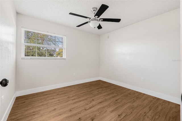 12641 98th St, Largo, FL 33773 - unfurnished room with ceiling fan, a textured ceiling, baseboards, and wood finished floors