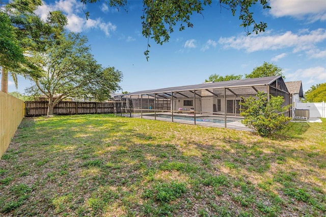 12641 98th St, Largo, FL 33773 - view of yard with a fenced backyard, glass enclosure, and a fenced in pool