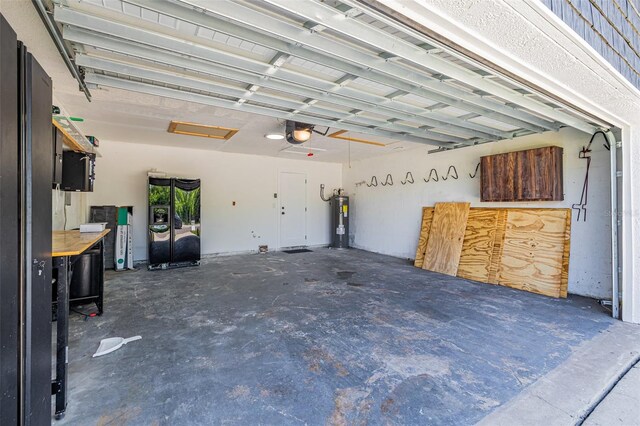 12641 98th St, Largo, FL 33773 - garage with water heater and a garage door opener