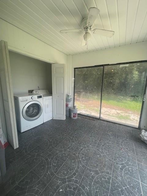 clothes washing area with laundry area, washing machine and clothes dryer, a ceiling fan, and wood ceiling