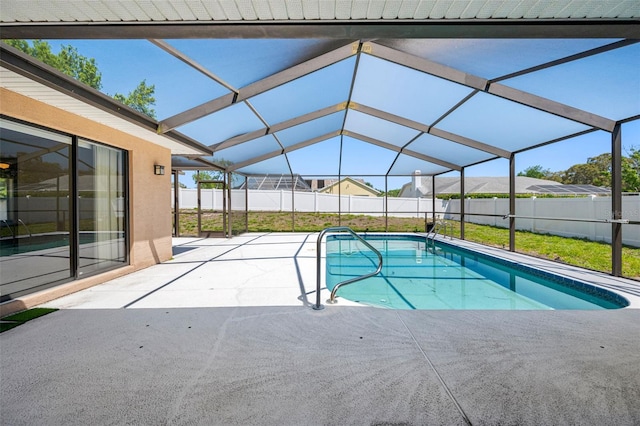 view of swimming pool with a fenced in pool, a patio area, a fenced backyard, and a lawn