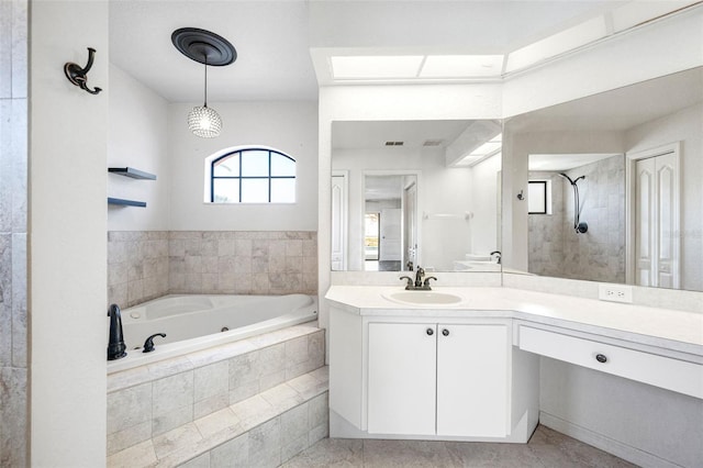bathroom featuring visible vents, vanity, tile patterned floors, tiled shower, and a garden tub