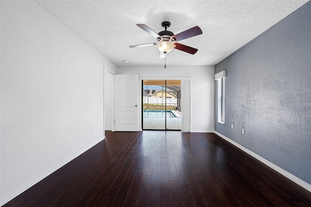 unfurnished room featuring a textured ceiling, a textured wall, and a ceiling fan