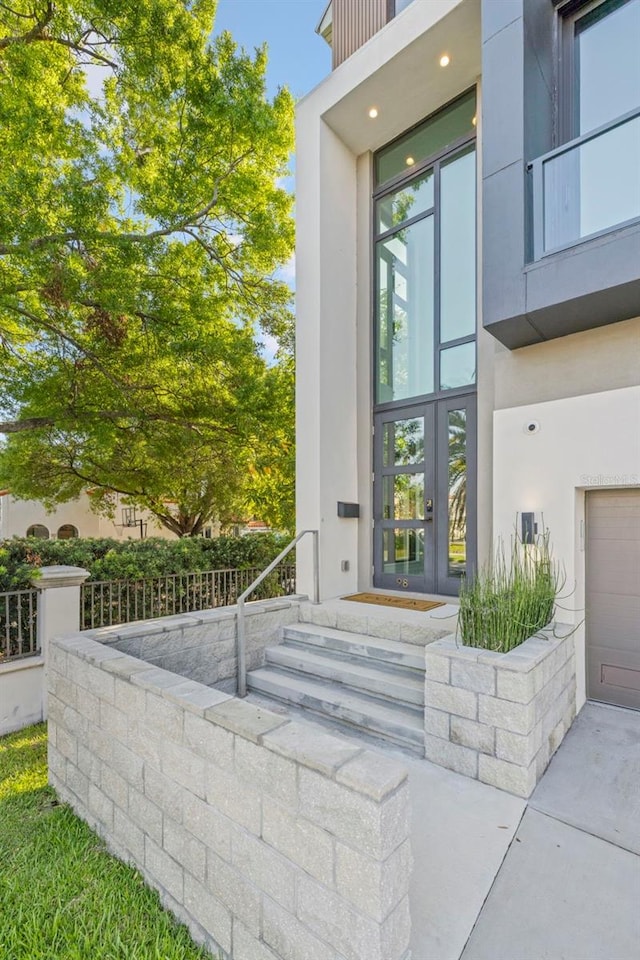 98 W Davis Blvd, Tampa, FL 33606 - property entrance with stucco siding and french doors