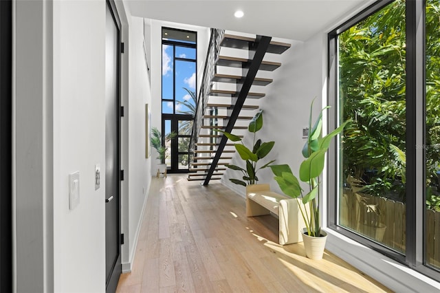 98 W Davis Blvd, Tampa, FL 33606 - corridor with baseboards, stairway, hardwood / wood-style floors, and floor to ceiling windows