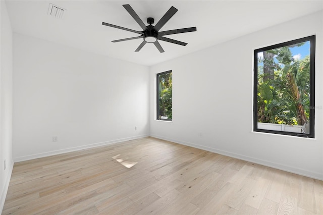 98 W Davis Blvd, Tampa, FL 33606 - spare room featuring light wood-style flooring, ceiling fan, baseboards, and visible vents