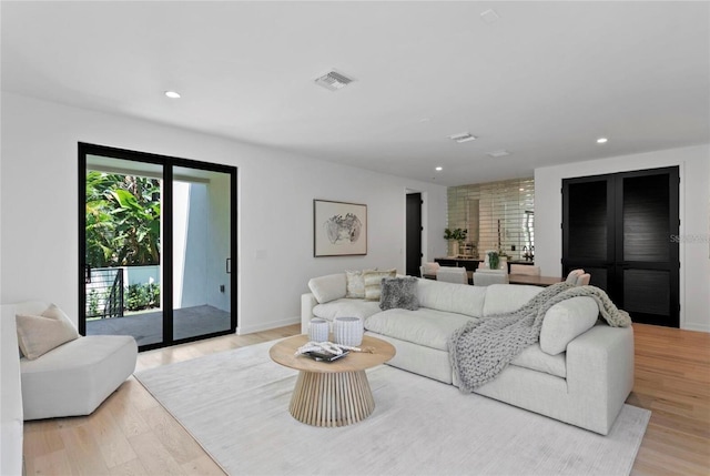 98 W Davis Blvd, Tampa, FL 33606 - living area featuring recessed lighting, light wood finished floors, visible vents, and baseboards