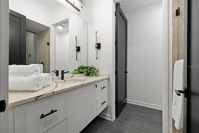 98 W Davis Blvd, Tampa, FL 33606 - full bathroom featuring baseboards, a shower stall, tile patterned flooring, and vanity