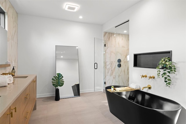 98 W Davis Blvd, Tampa, FL 33606 - full bathroom with baseboards, a soaking tub, a shower stall, recessed lighting, and vanity