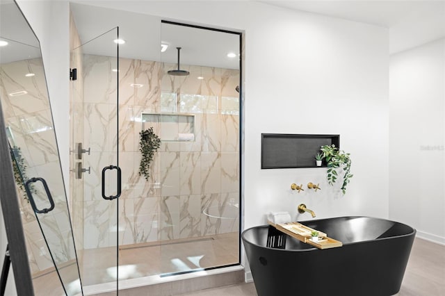 98 W Davis Blvd, Tampa, FL 33606 - full bathroom with a freestanding tub, a marble finish shower, baseboards, and recessed lighting