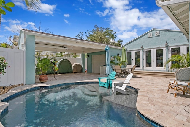 636 16th Ave NE, Saint Petersburg, FL 33704 - view of swimming pool featuring a patio, french doors, and fence