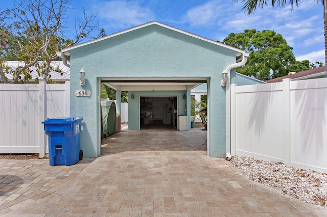 636 16th Ave NE, Saint Petersburg, FL 33704 - exterior space with fence and decorative driveway