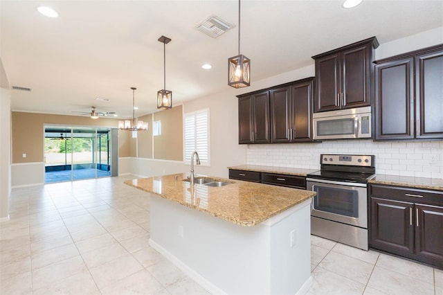 kitchen with recessed lighting, light tile patterned flooring, visible vents, stainless steel appliances, and a sink
