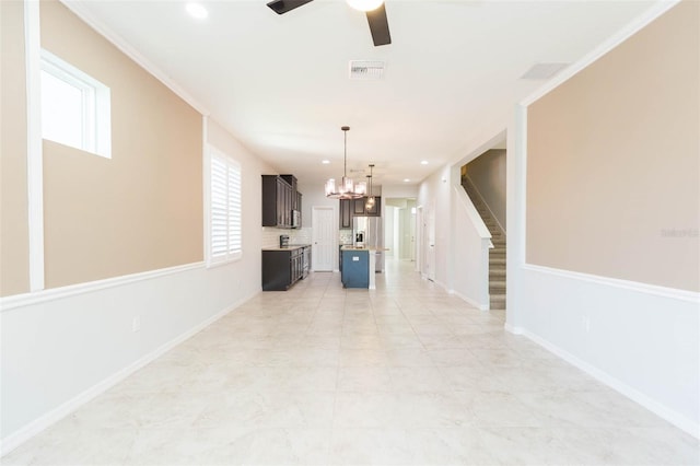interior space featuring visible vents, recessed lighting, stairs, and ceiling fan with notable chandelier