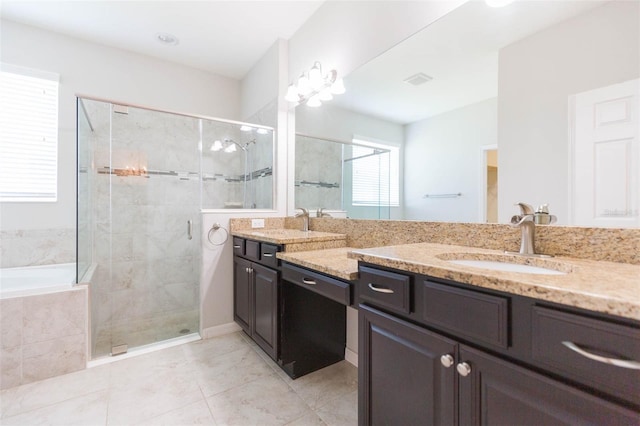 full bath with a garden tub, a sink, a stall shower, double vanity, and tile patterned floors