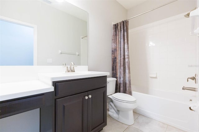 bathroom featuring toilet, tile patterned floors, shower / bath combo with shower curtain, and vanity
