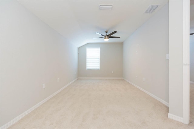 bonus room featuring visible vents, ceiling fan, light carpet, and lofted ceiling
