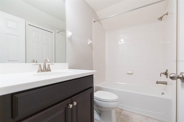bathroom featuring toilet, tile patterned floors, vanity, and shower / bathtub combination
