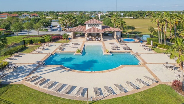 pool with a gazebo, a patio area, and fence