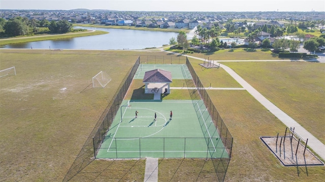 drone / aerial view with a water view and a residential view