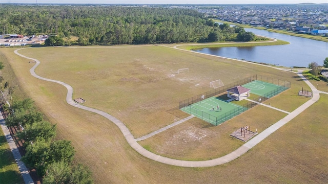 bird's eye view featuring a water view and a forest view