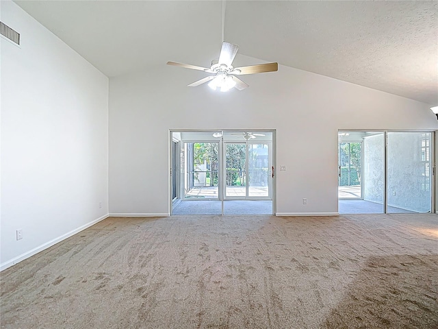 carpeted empty room with visible vents, baseboards, a ceiling fan, a textured ceiling, and high vaulted ceiling