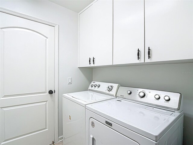 laundry room with cabinet space and independent washer and dryer