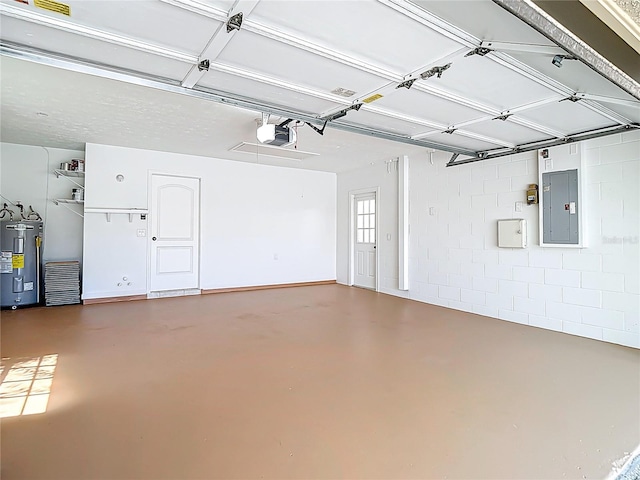 garage featuring a garage door opener, concrete block wall, electric panel, and water heater