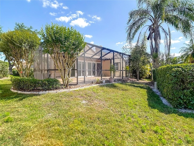 view of yard featuring glass enclosure
