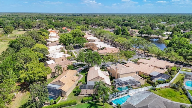 aerial view with a wooded view and a residential view