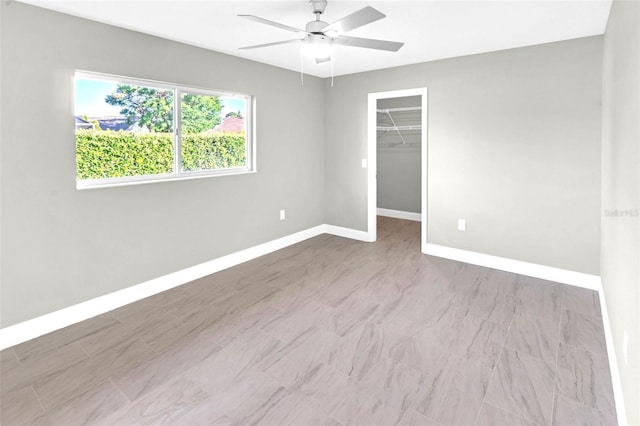 6994 Country Lakes Cir, Sarasota, FL 34243 - empty room featuring a ceiling fan and baseboards