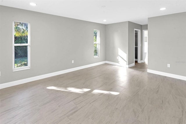 6994 Country Lakes Cir, Sarasota, FL 34243 - empty room featuring baseboards and recessed lighting