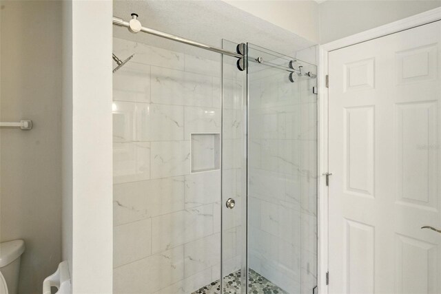 6994 Country Lakes Cir, Sarasota, FL 34243 - bathroom with a stall shower and toilet