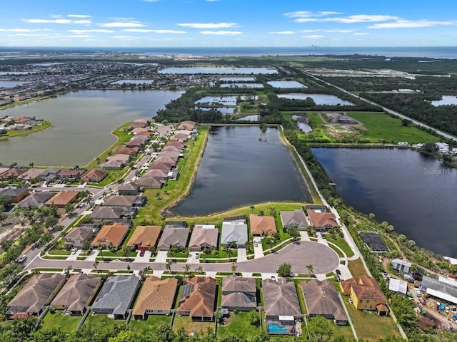 birds eye view of property featuring a residential view and a water view