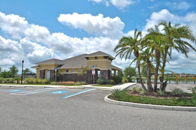 view of property featuring uncovered parking