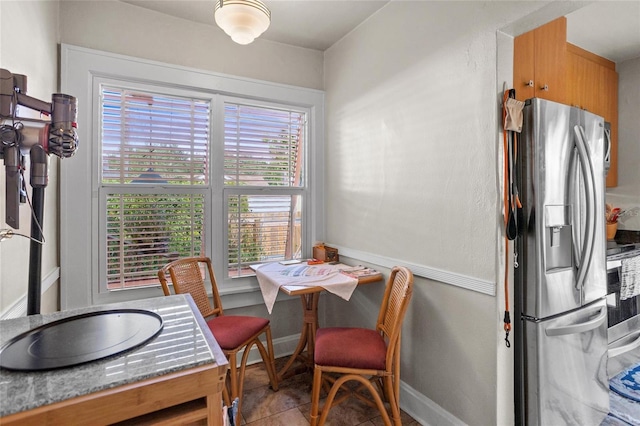 3120 8th Ave N, Saint Petersburg, FL 33713 - dining area with baseboards and tile patterned flooring