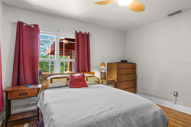 3120 8th Ave N, Saint Petersburg, FL 33713 - bedroom featuring wood finished floors, baseboards, and ceiling fan