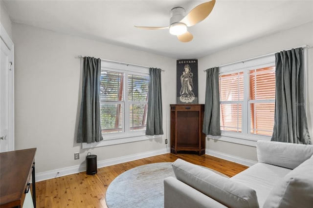 3120 8th Ave N, Saint Petersburg, FL 33713 - living area with baseboards, light wood-style floors, and a ceiling fan