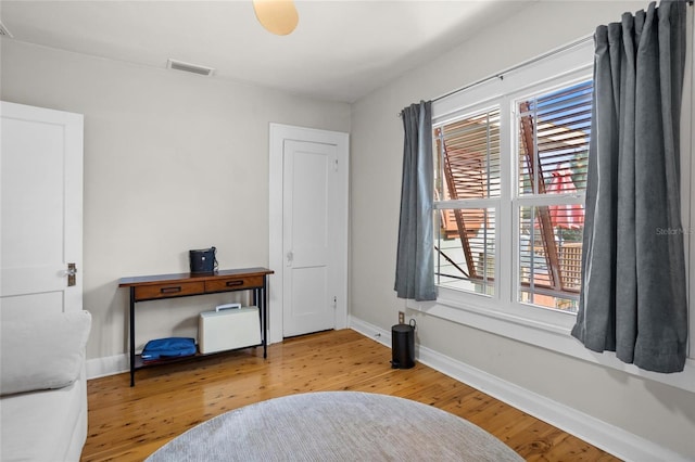 3120 8th Ave N, Saint Petersburg, FL 33713 - bedroom featuring multiple windows, wood finished floors, and baseboards