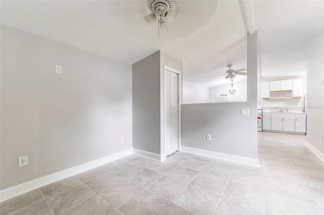 2017 Oceanview Pl, Tampa, FL 33605 - unfurnished room with a ceiling fan, baseboards, a sink, and light tile patterned floors
